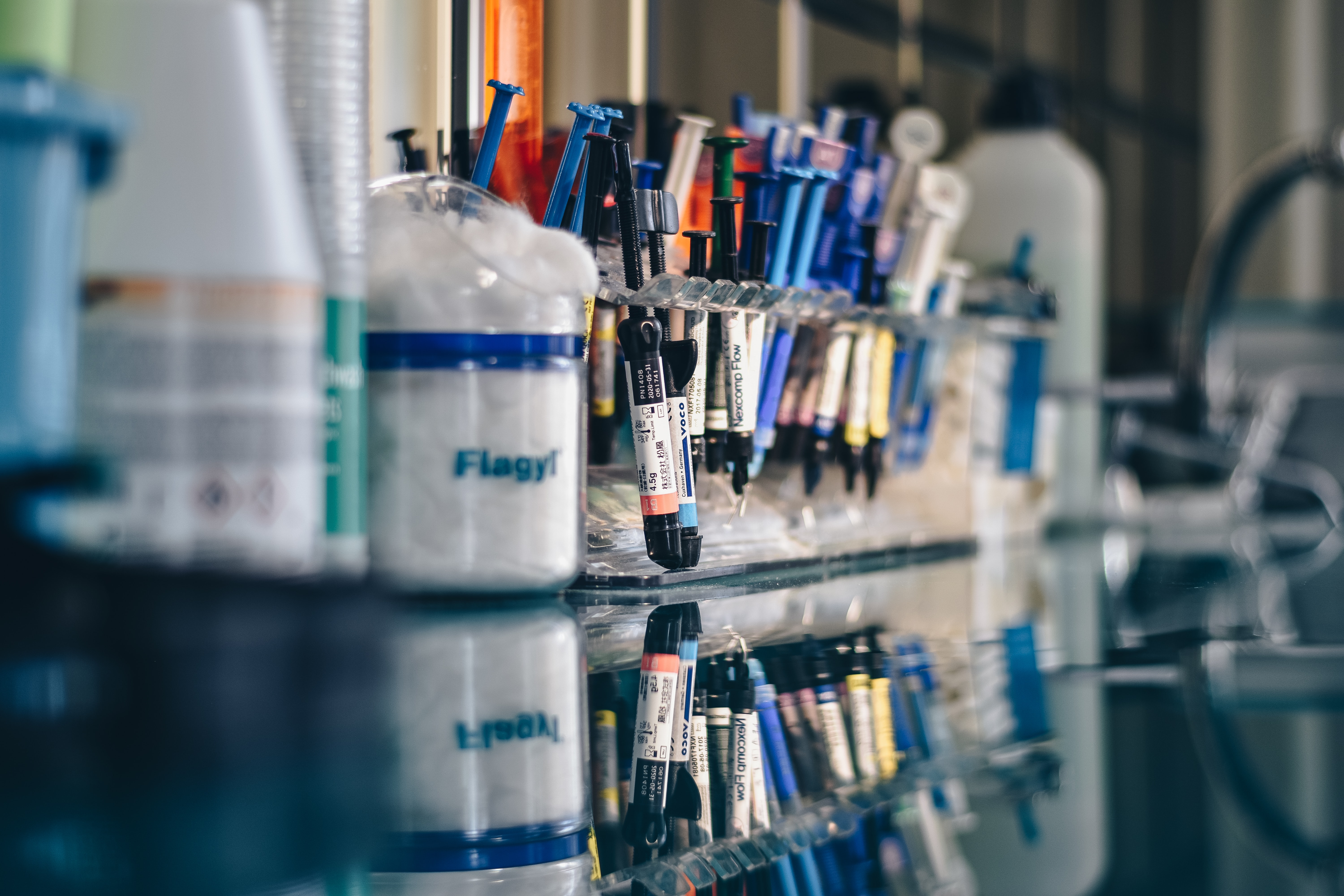 a bunch of syringes on a lab desk